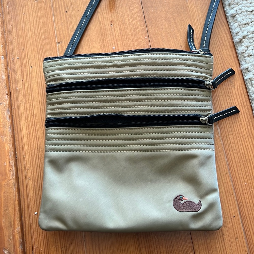 Dooney and Bourke nylon and leather crossbody bag - tan with pink interior